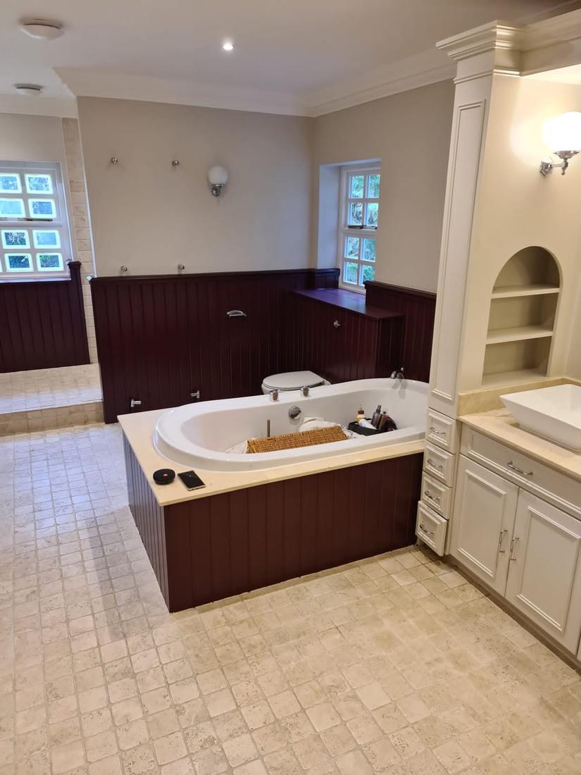Bathroom with burgundy panelling