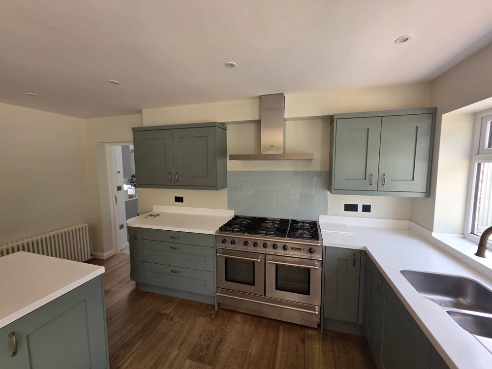 Kitchen units painted sage green