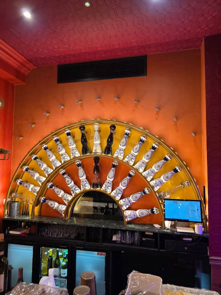 Restaurant bar with painted orange feature wall